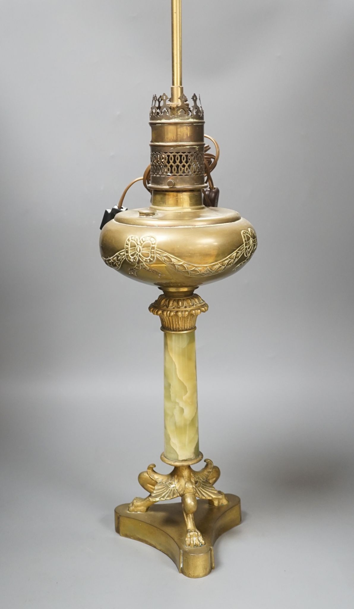 A French gilded bronze and green onyx oil lamp (converted to electricity later), 84 cms including light fitting.